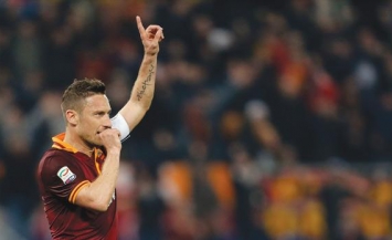 Roma's legendary captain  celebrating his team's win against Udinese this season.